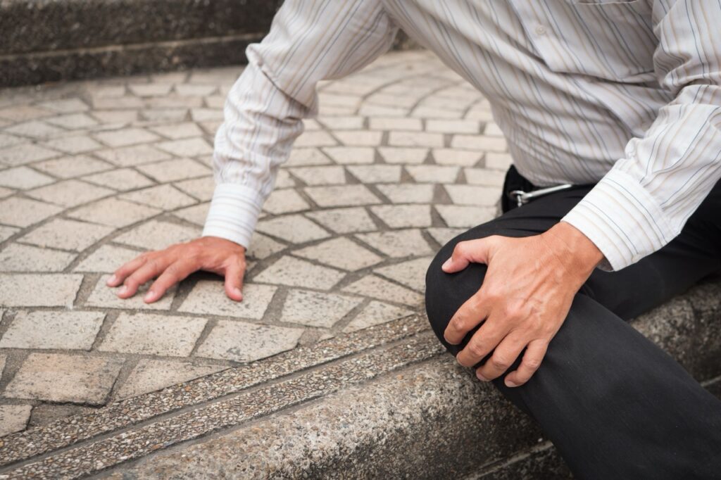 man holding his knee